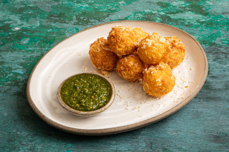 Aligot croquettes with herb dipping oil