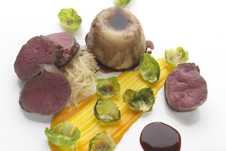 Slow-cooked venison suet pudding with choucroute and carrot purée