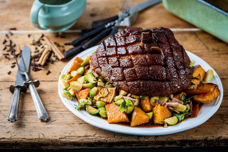 Roast gammon with sweet potato roasties and bacon sprouts