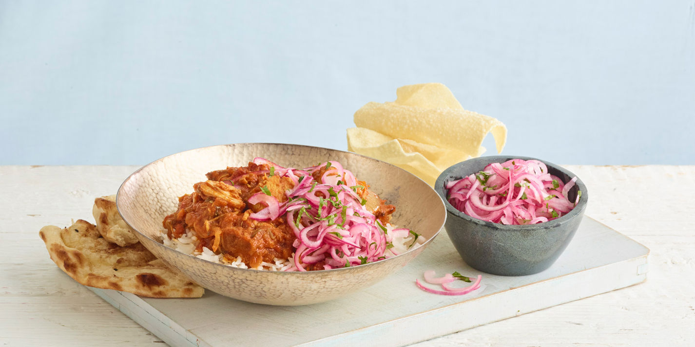 Quick Chicken Curry with Coriander and Quick-Pickled Red Onion, plated