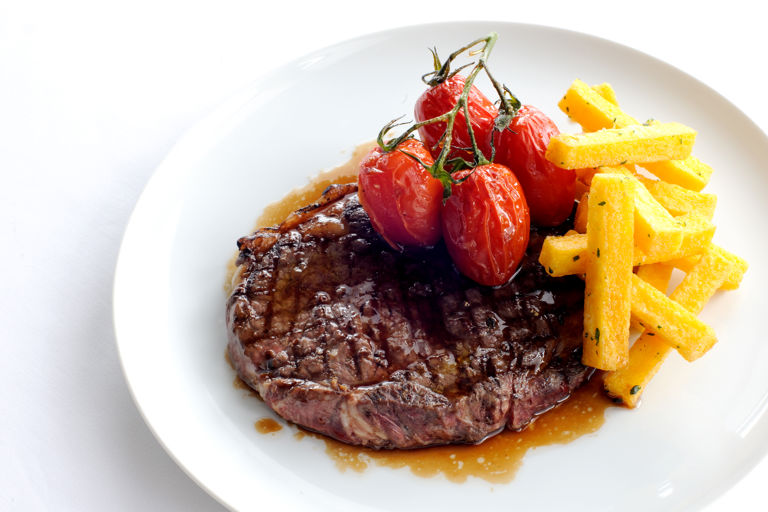 Rib-eye of beef with polenta chips
