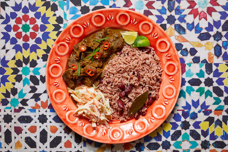 Curry goat with rice and peas