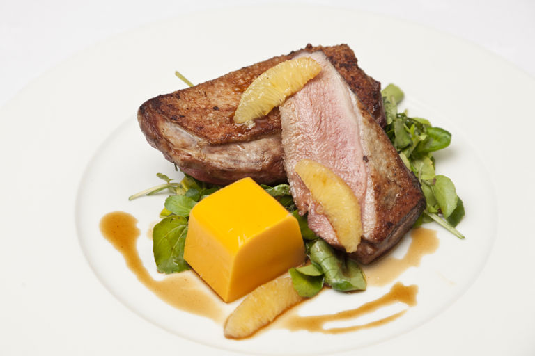Roast duck crowns with wilted watercress, butternut squash mousse and bigarade sauce 