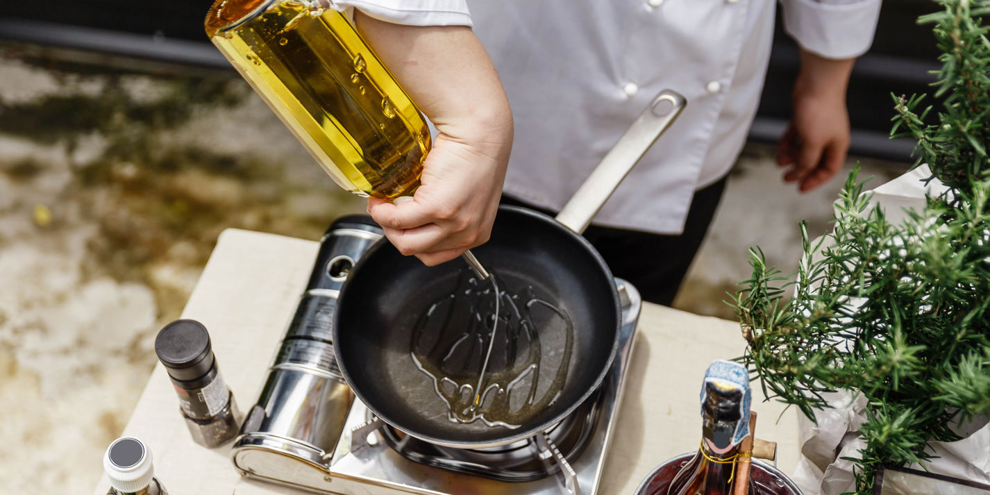 Should olive oil be added to a hot or cold pan?