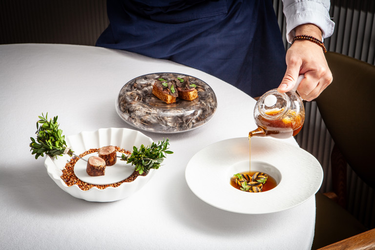 Quail tortellini and stuffed quail with mushroom consommé and quail liver parfait brioche