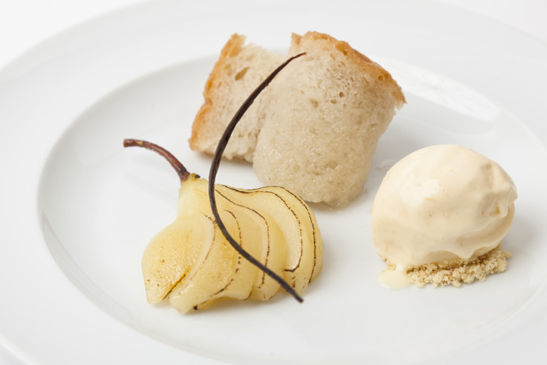 Rum baba with spiced, poached pears and ginger ice cream