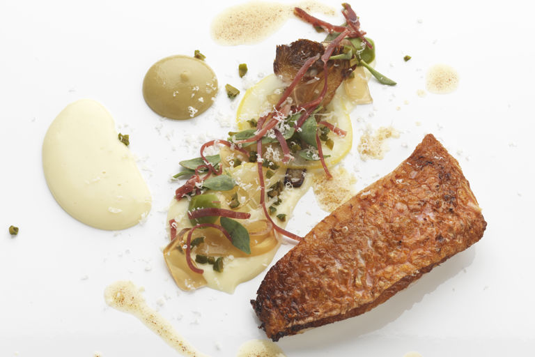 Stuffed red mullet with a Parmesan purée, caramelised artichokes and green olive powder