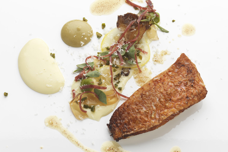 Stuffed red mullet with a Parmesan purée, caramelised artichokes and green olive powder