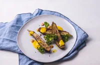 Spiced aubergine with turmeric and coconut sauce, cashew butter and crispy kale