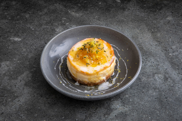 Mini lemon drizzle cheesecakes with pear compote and thyme-infused honey