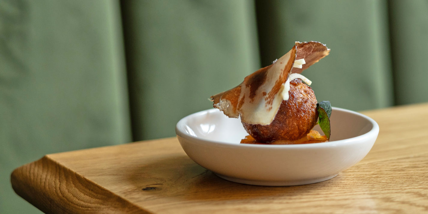 Belfast blue cheese and Bramley apple doughnut with crispy potato cake and coppa