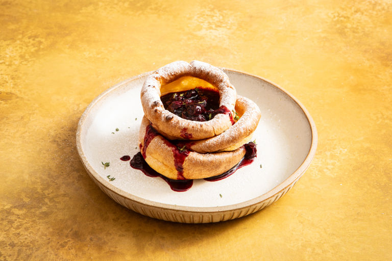 Mini Dutch baby pancakes with blueberry syrup