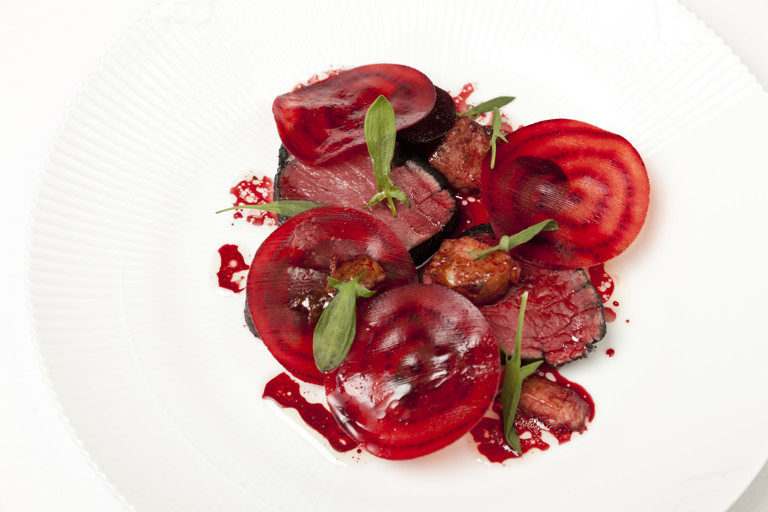 Beef fillet in burnt hay with smoked bone marrow, salt baked and raw beetroot