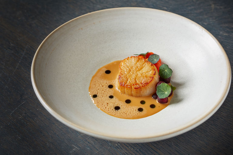 Roasted scallop with pickled carrots, nasturtiums and shellfish sauce
