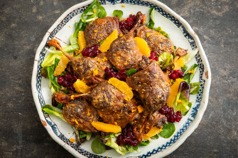 Confit duck leg platter with cranberry sauce