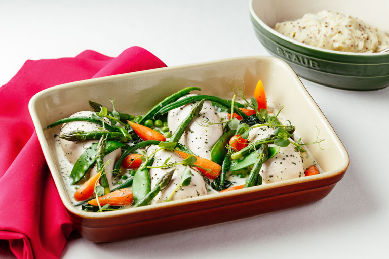 Poached chicken breast with summer vegetables, wholegrain mustard mash and tarragon sauce 
