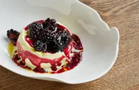 Goat's milk and fig leaf ice cream with blackcurrant juice, blackberries and olive oil