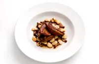 Roast pigeon with braised butter beans