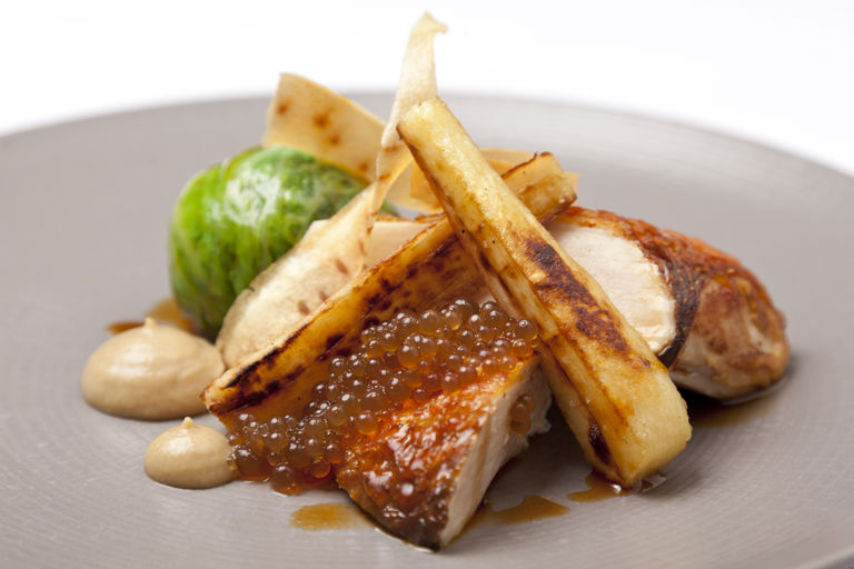 Poached and roasted pheasant with Savoy cabbage, roast parsnips and sherry vinegar pearls