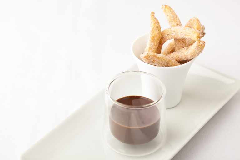 Cinnamon doughnuts and chocolate sauce
