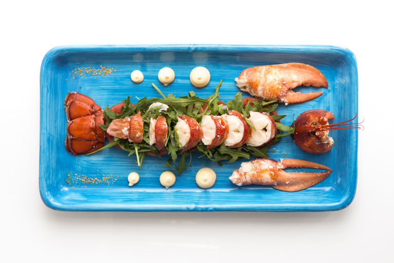 \capri lobster with tomatoes, rocket salad and marinated spring onion