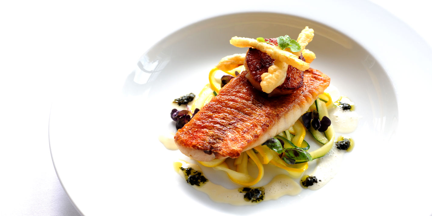 Pan-fried red mullet on courgette tagliatelle with scallops and purple basil pesto