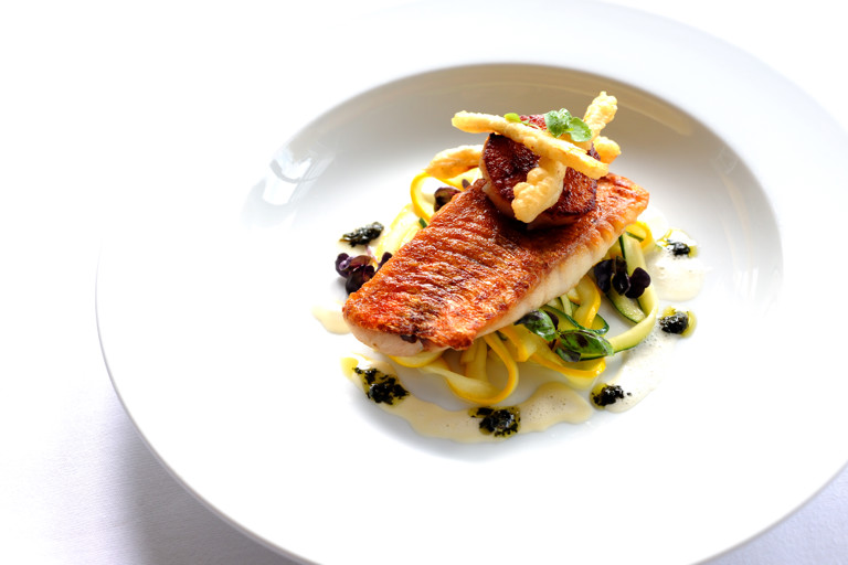 Pan-fried red mullet on courgette tagliatelle with scallops and purple basil pesto