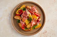 Potatoes with Iberico ham and piquillo peppers
