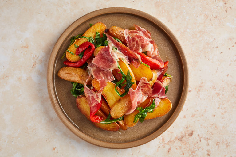 Potatoes with Iberico ham and piquillo peppers