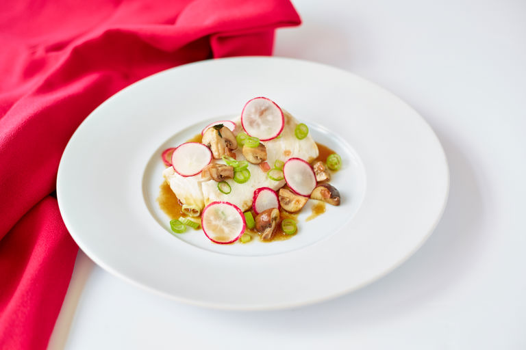 Poached hake with honey and soy vinaigrette and quick-pickled mushrooms