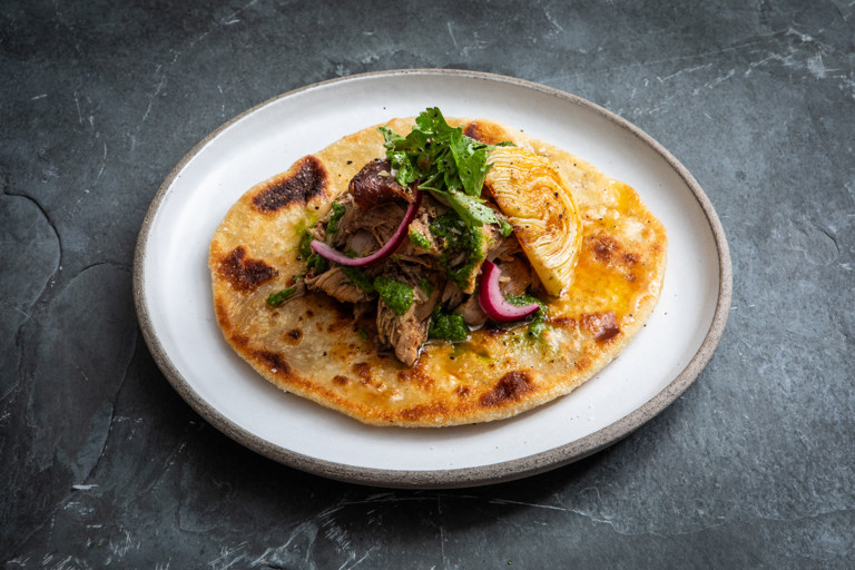 Lamb barbacoa with charred cabbage, salsa and flatbreads
