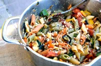 Mezze penne tricolour with roasted summer vegetables and walnuts