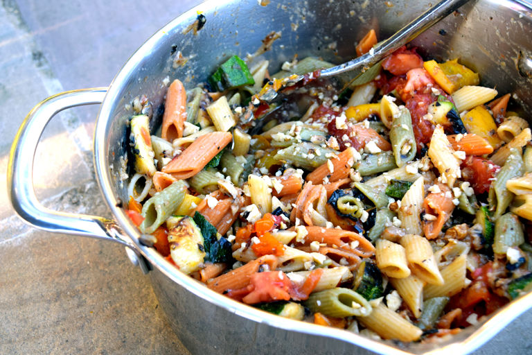 Mezze penne tricolour with roasted summer vegetables and walnuts