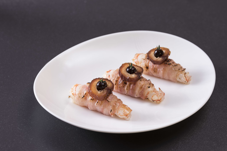 'Shrimp in mink' - langoustines wrapped in pancetta with date puree