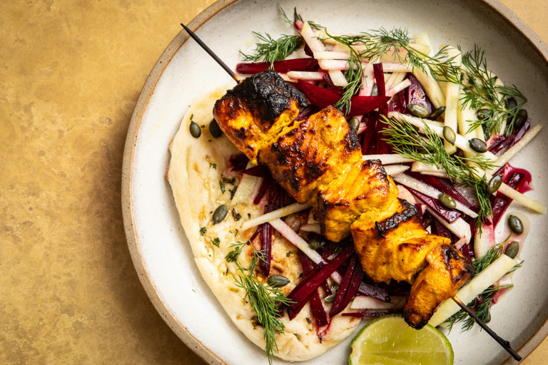 Salmon tikka skewers with garlic naan and beetroot and apple salad