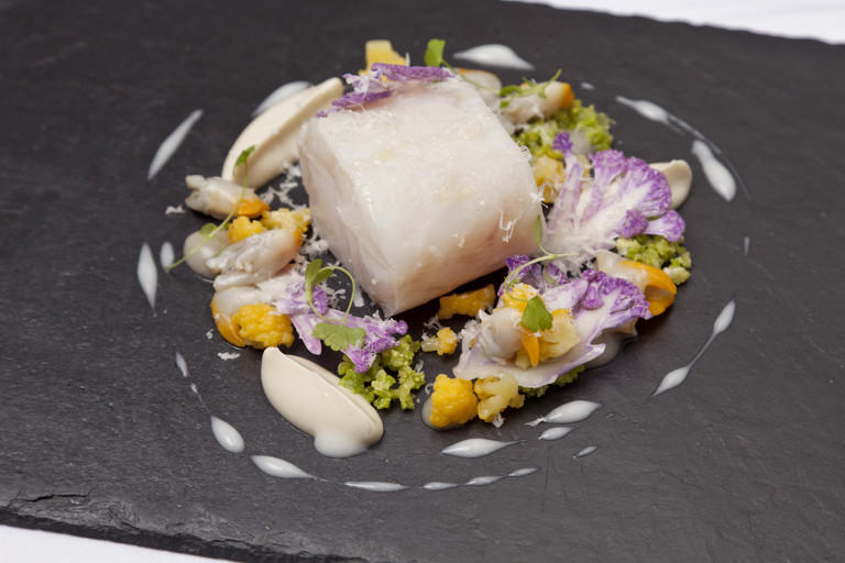 Confit pollock with cauliflower, cockles and Parmesan
