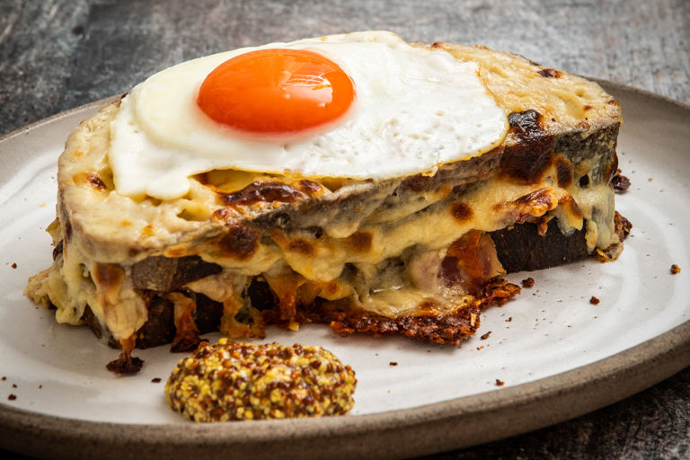 Ham hock croque madame with beer-caramelised onions