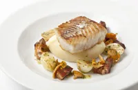 Pan-fried halibut with smoked bacon and girolles