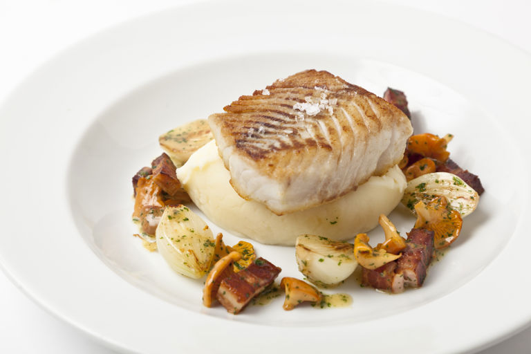 Pan-fried halibut with smoked bacon and girolles