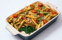 Confit duck leg with penne, spinach and tomato