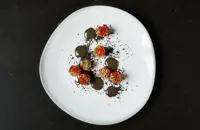 Piccolo tomatoes stuffed with tapioca and black garlic
