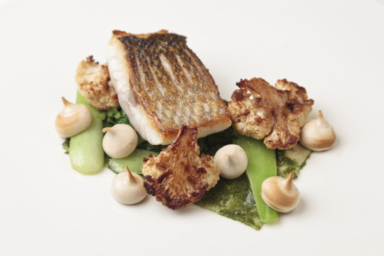 Sea bass with soy sauce meringue, pak choi and cauliflower
