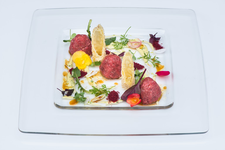 Beef tartare with sesame cannelloni and olive oil and chive sauce