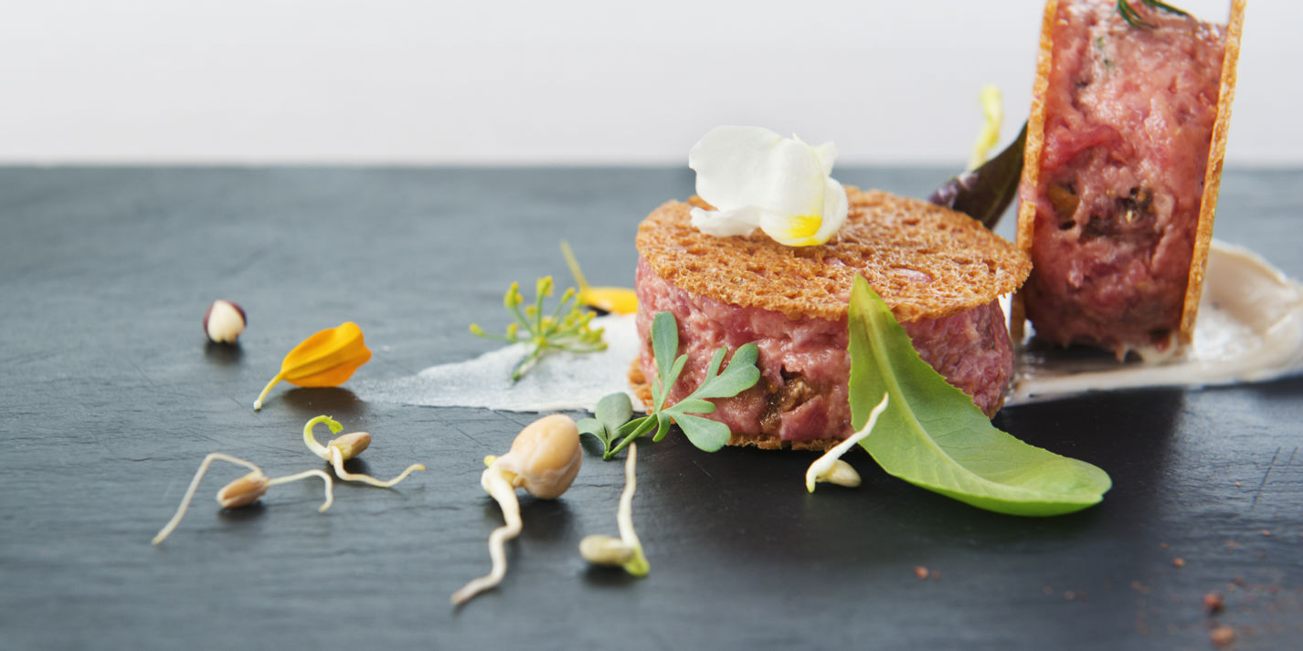 Veal tartare with figs, hazelnuts and anchovy butter