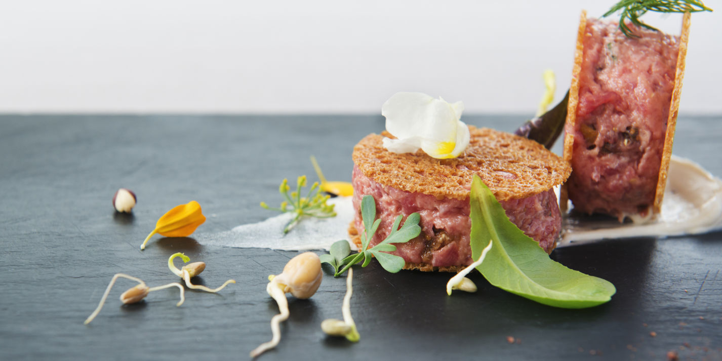 Veal tartare with figs, hazelnuts and anchovy butter