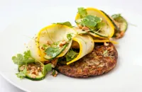 Courgette, spelt and cumin fritters, courgette, parsley and cashew salad