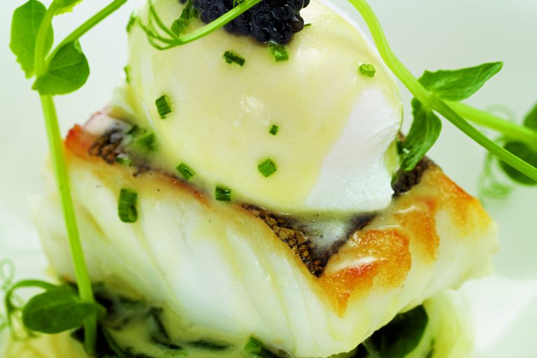 Fillet of cod with poached hen's egg, crushed Jersey Royals and chive butter sauce
