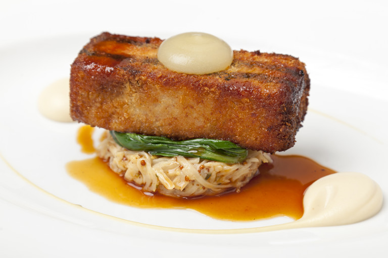 Crispy pork belly with black pudding, celeriac remoulade and apple purée