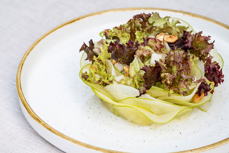 Kohlrabi and apple salad, with cobnuts, lollo rosso and apple cider vinegar