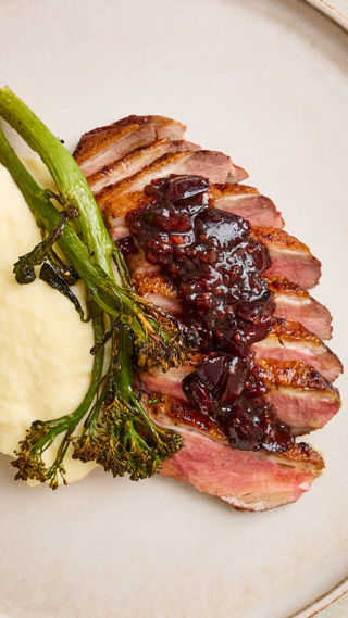 Duck breast with cherry hoisin sauce, pommes purée and charred broccoli recipe reel